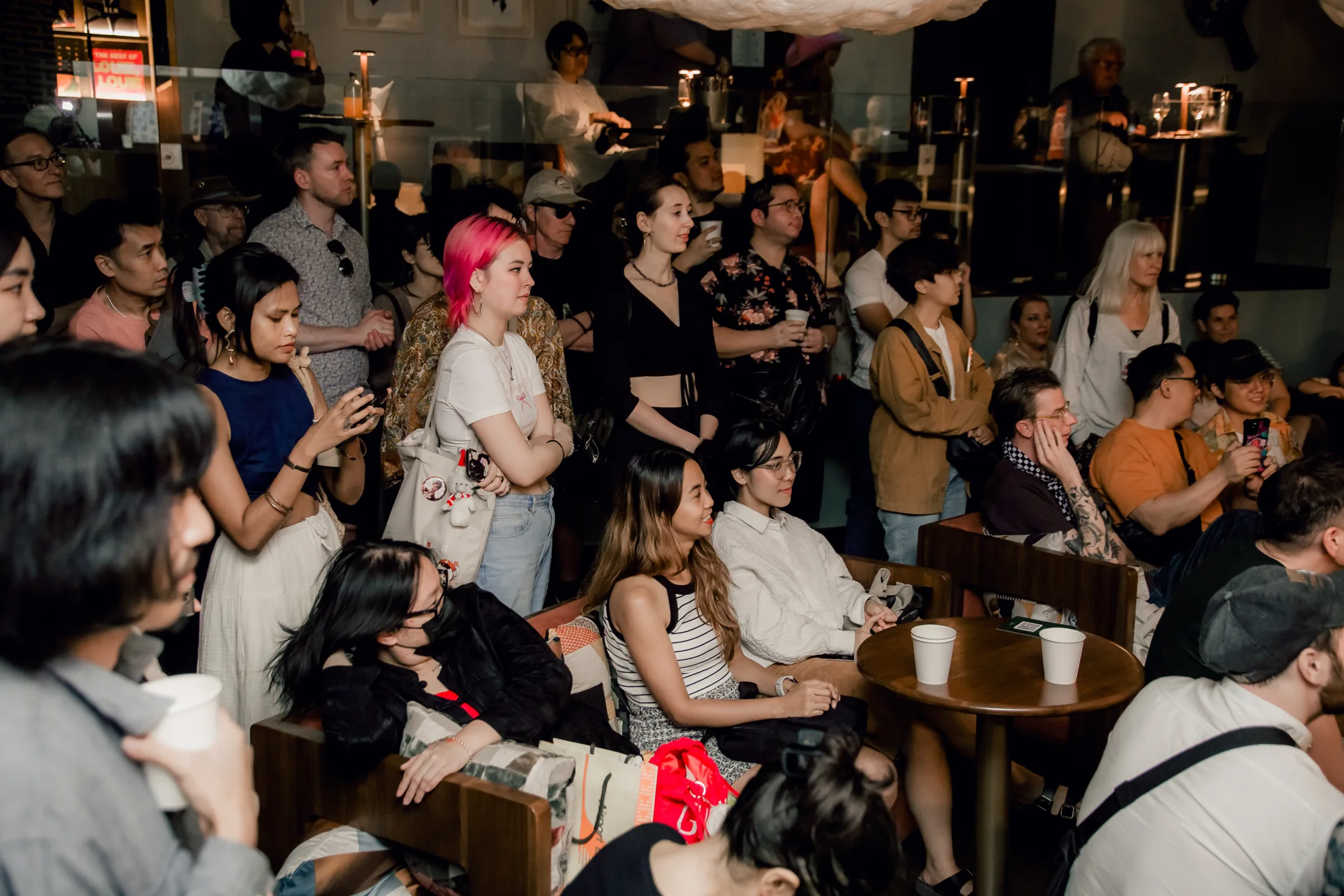 A full room listening closely at Public House Bangkok